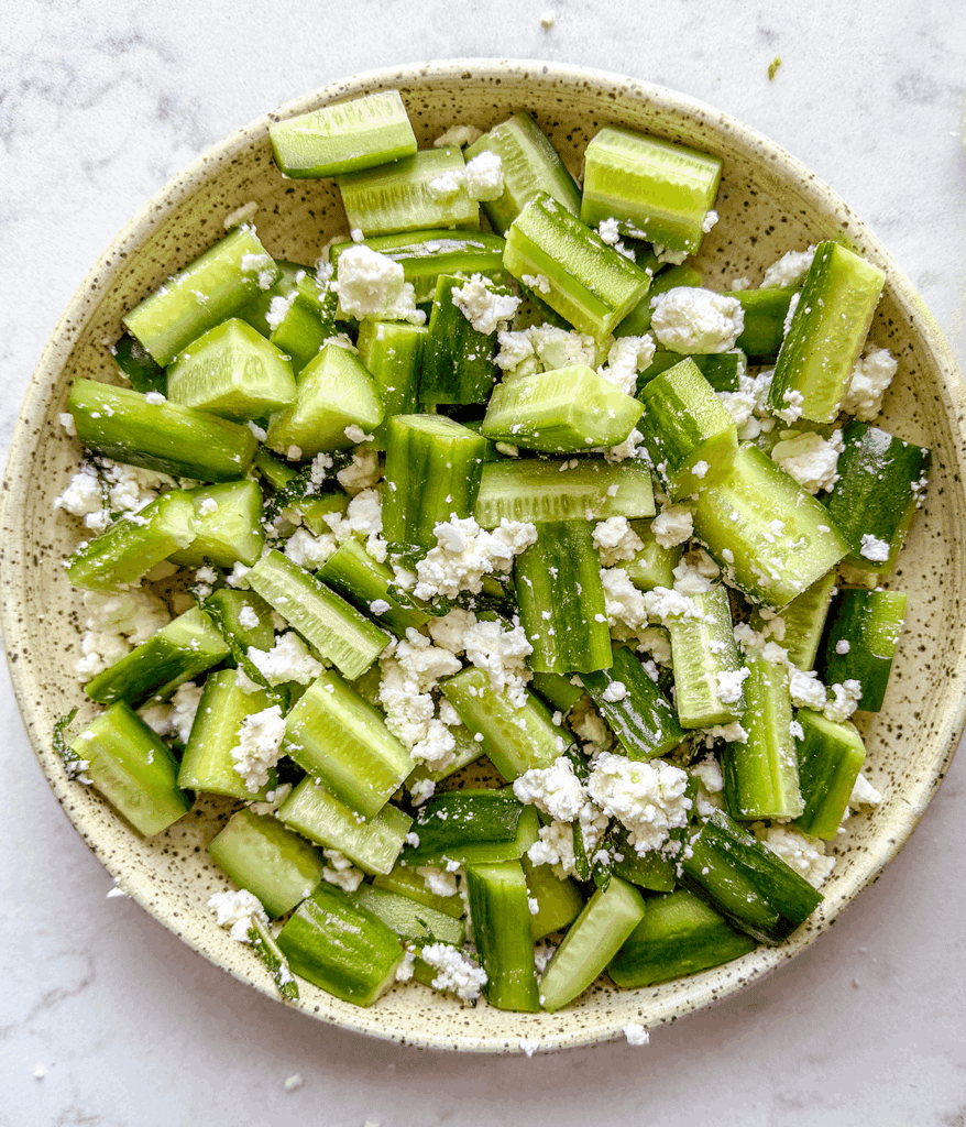 cucumbers and feta in bowl for baby cucumber salad