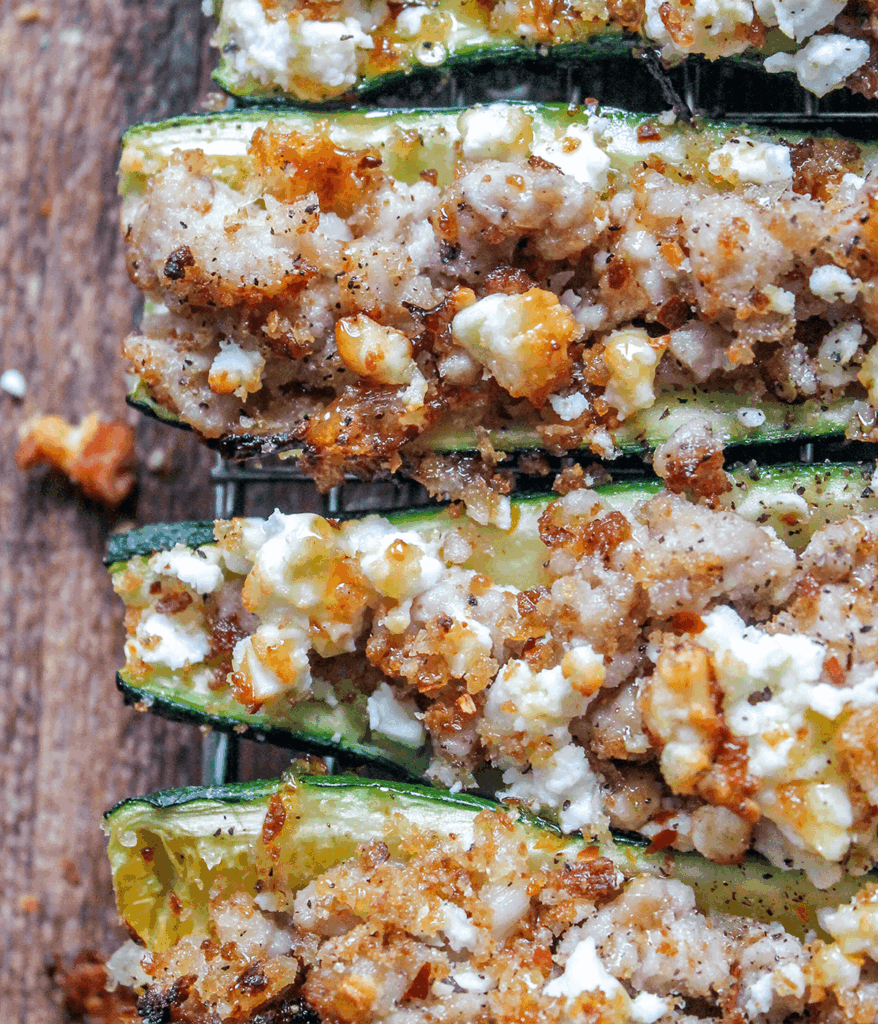 close up of stuffed zucchini boats