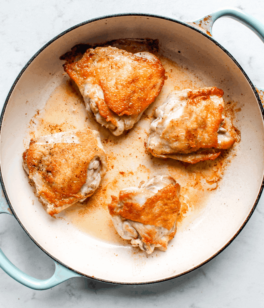 chicken in pot for spicy coconut chicken soup