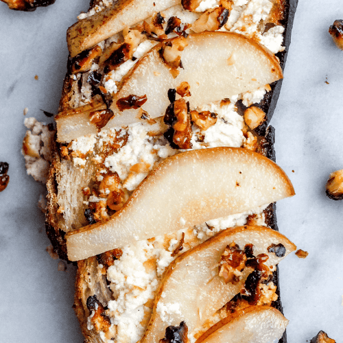 Baked goat cheese and pear toast with hot honey candied walnuts bon