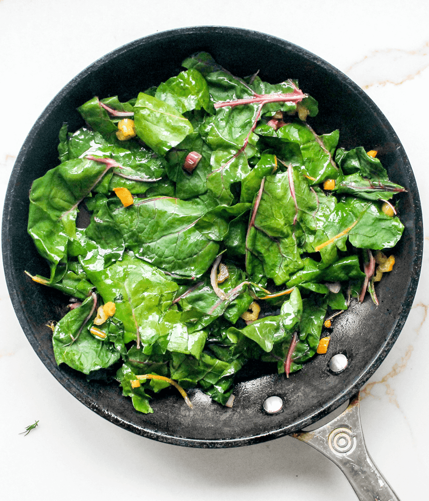 a pan with swiss chard leaves in it