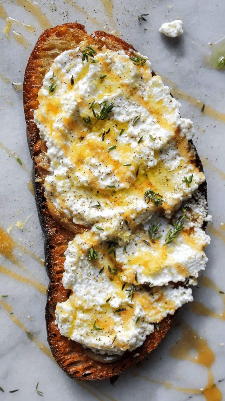 Lemon Thyme Garlic Confit Toast with Ricotta & Hot Honey - bon abbetit