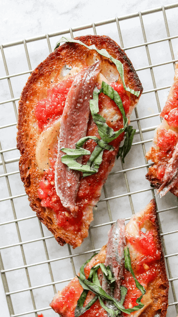 close up of pan con tomate with anchovies