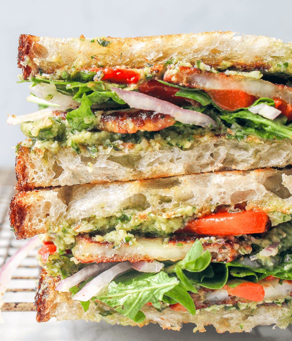 close up of pesto hummus sandwich