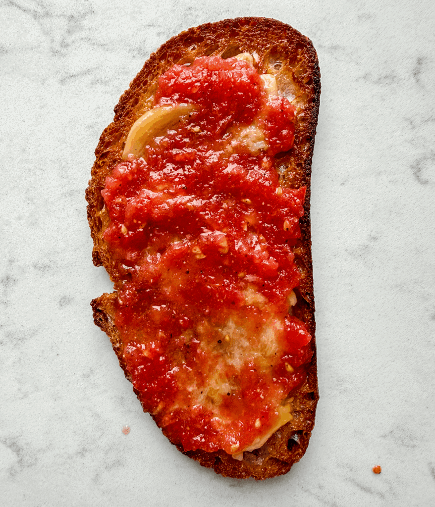 tomato and garlic on toast for pan con tomate with anchovies