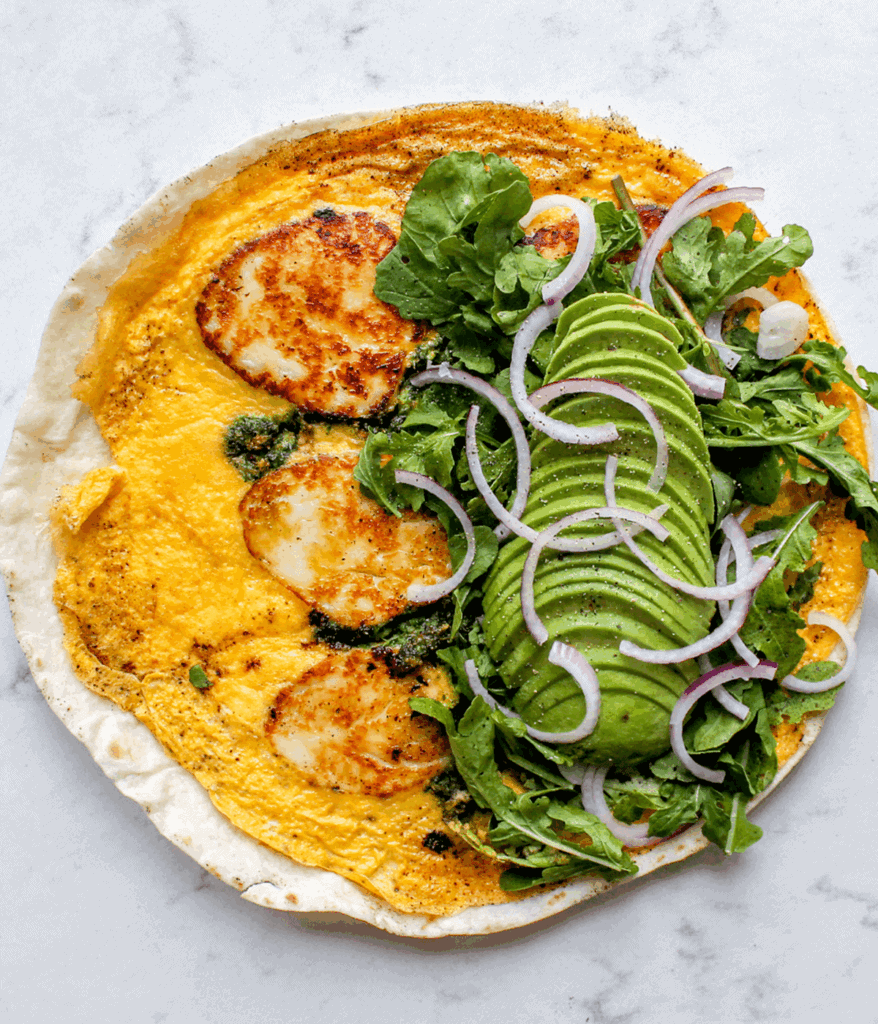 layered ingredients of halloumi egg wrap