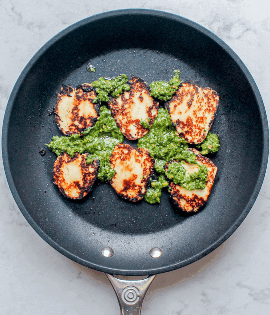 pesto and halloumi in a pan for halloumi egg wrap