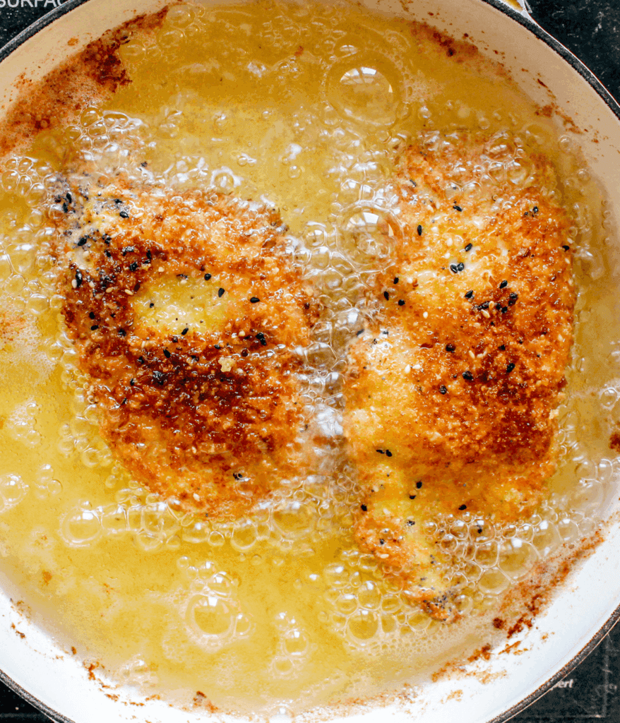frying chicken in oil for crispy chicken sandwich pickled slaw