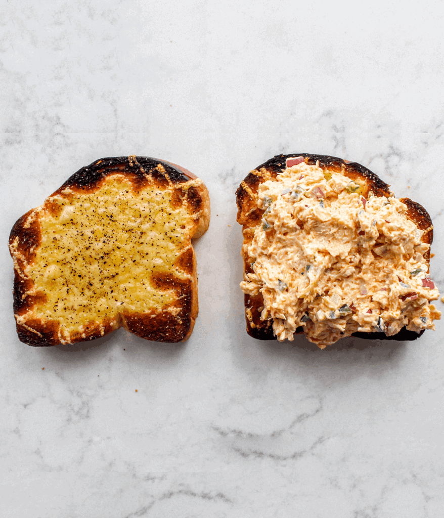 Toasted bread with melted cheese and spicy jalapeños, ready to enjoy.