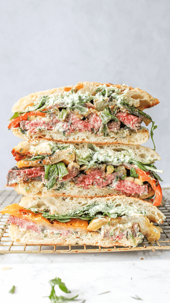 Stacked steak and vegetable sandwich