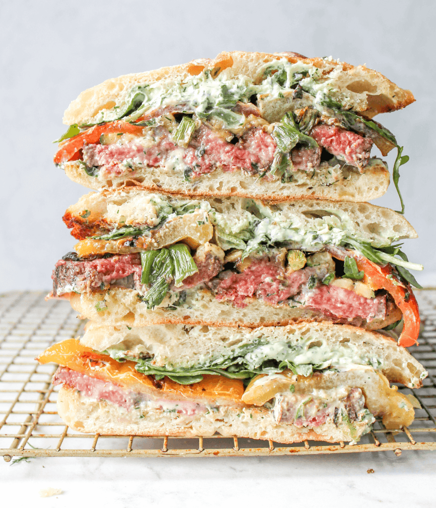 Stacked steak and vegetable sandwich