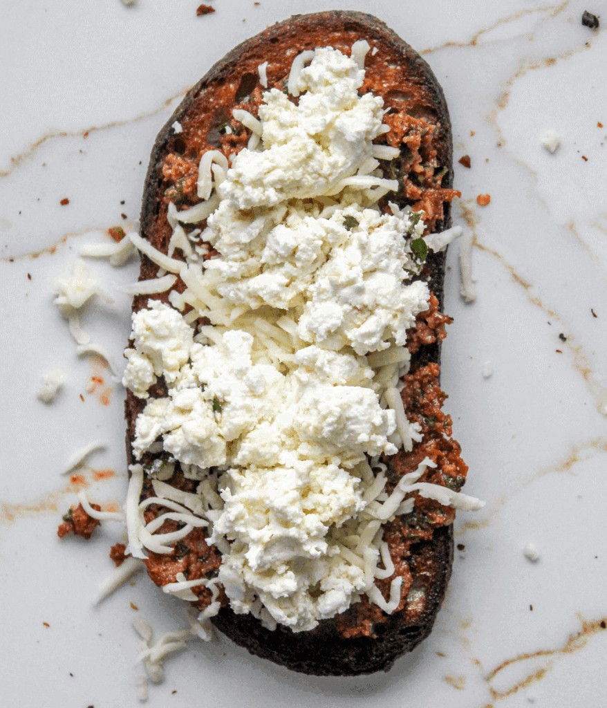 goat cheese and mozzarella cheese on bread for sundried tomato grilled cheese