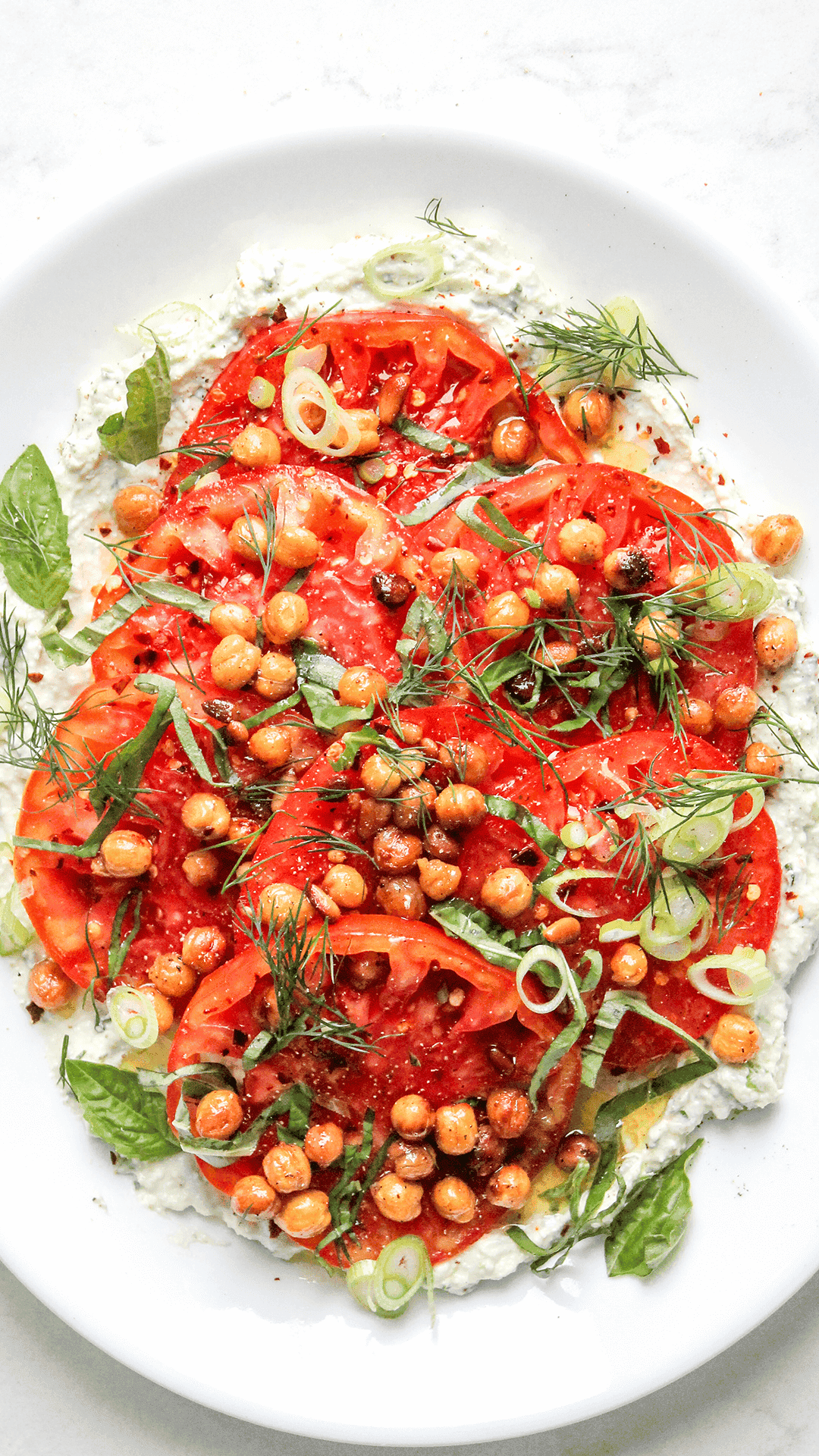 a plate with chickpea tomato cottage cheese salad