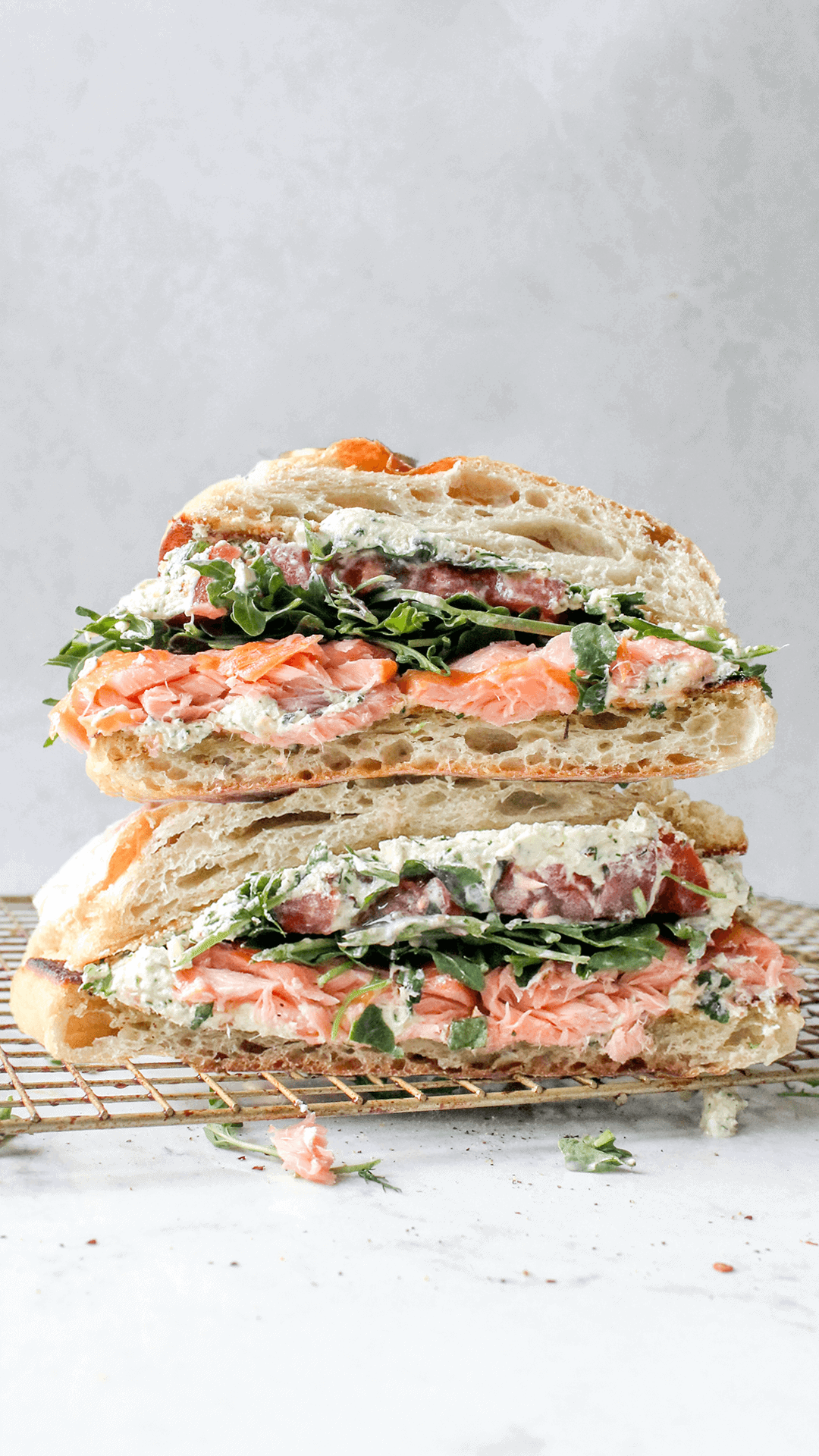 stacked close up of Salmon goat cheese sandwich