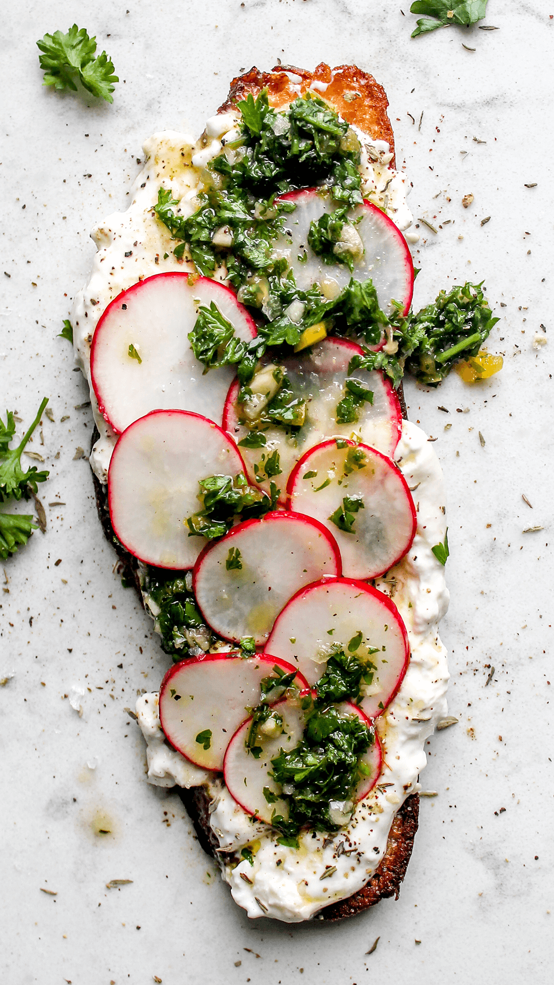 toast with burrata chimichurri and radishes