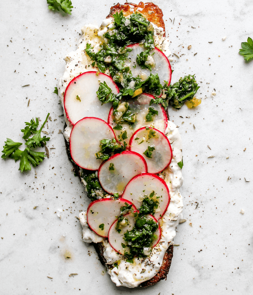 toast with burrata chimichurri and radishes
