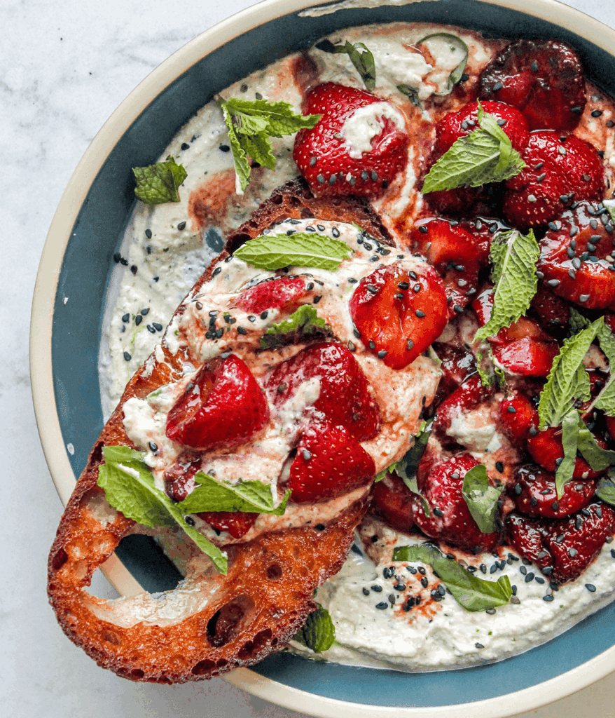 bowl of whipped feta balsamic strawberries with toasted sourdough