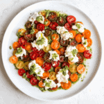 pesto tomato and burrata plate