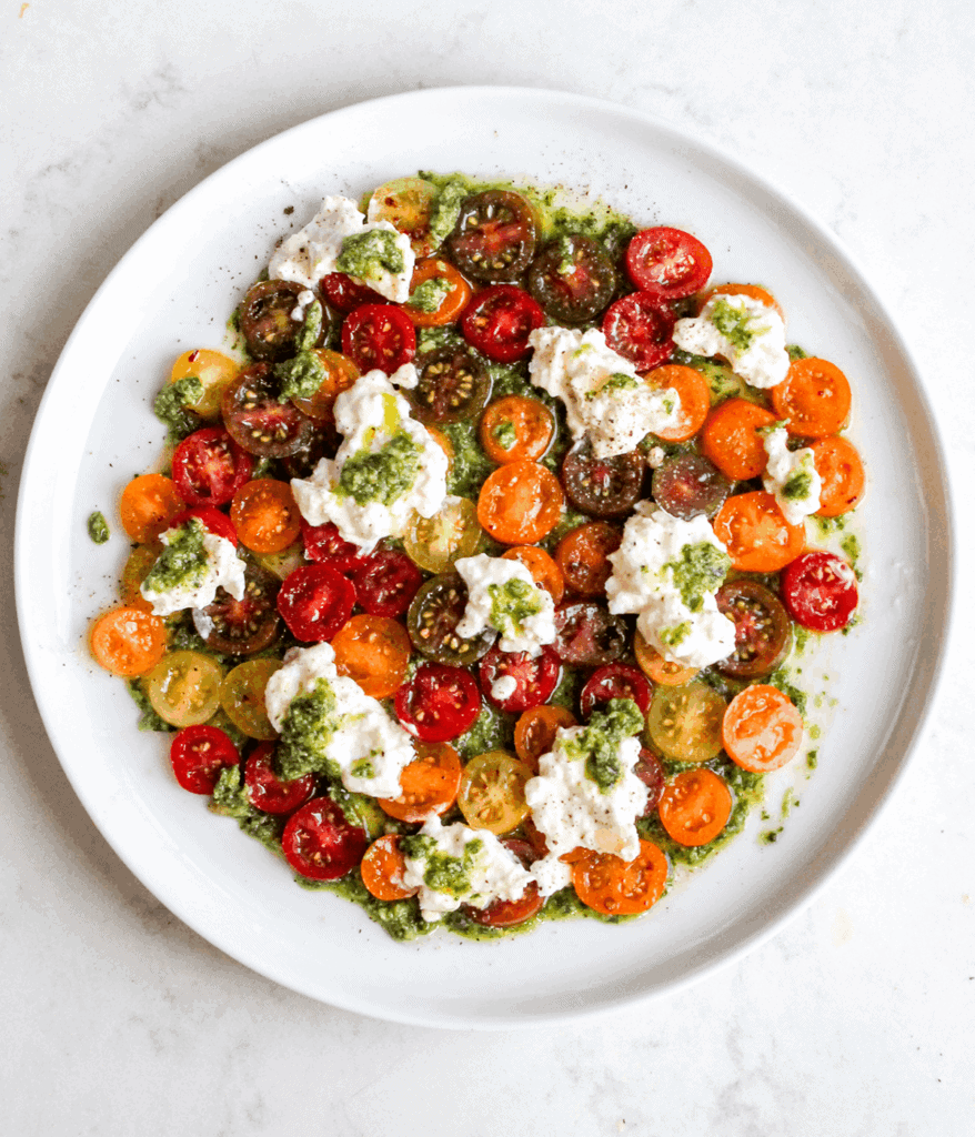 pesto tomato and burrata plate