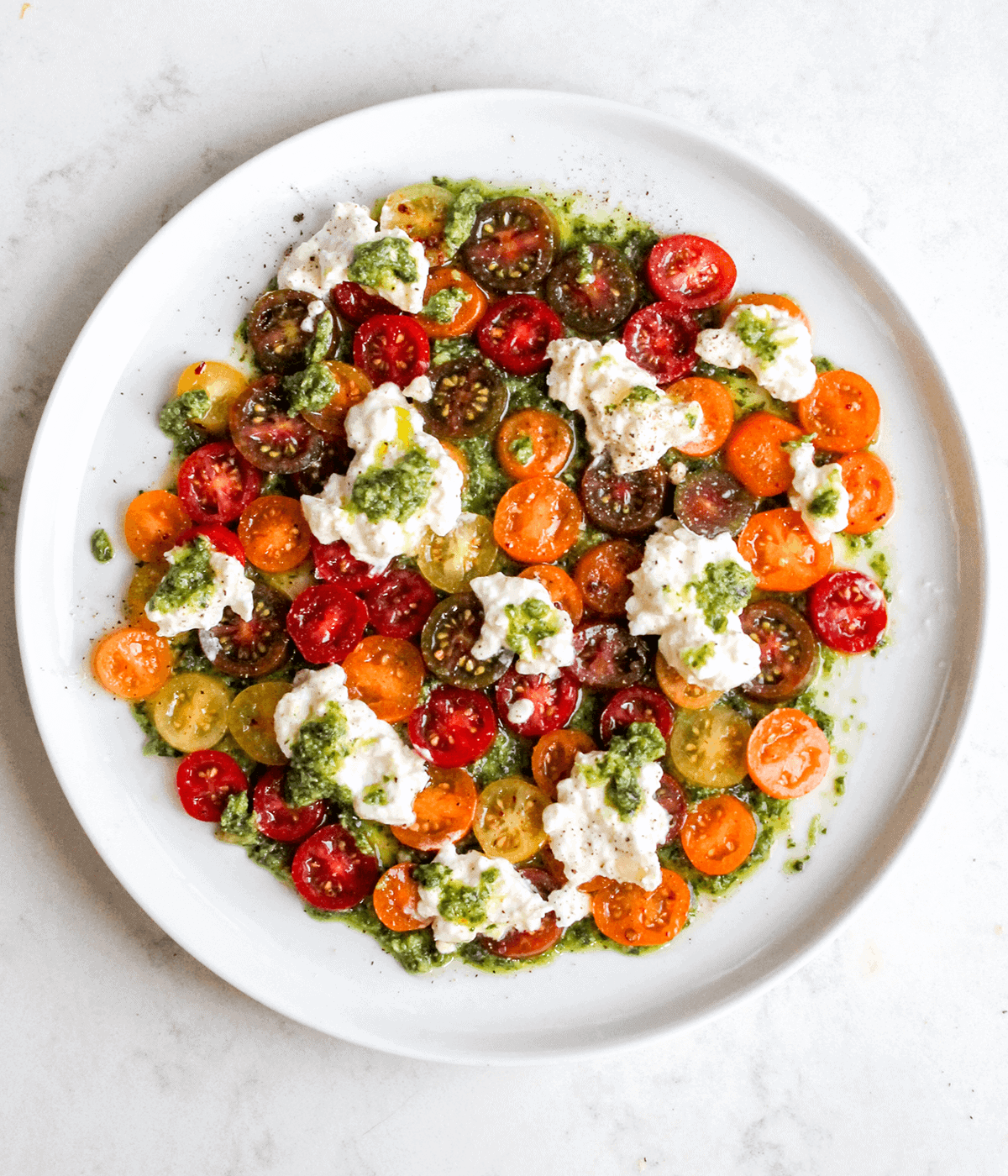 pesto tomato and burrata plate