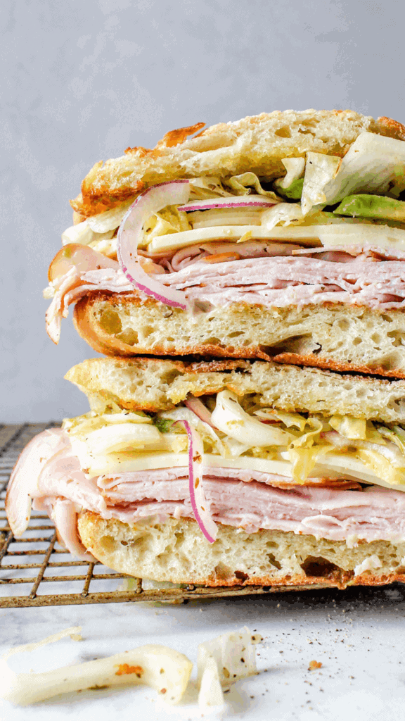 close up of ham and cheddar cheese sandwich