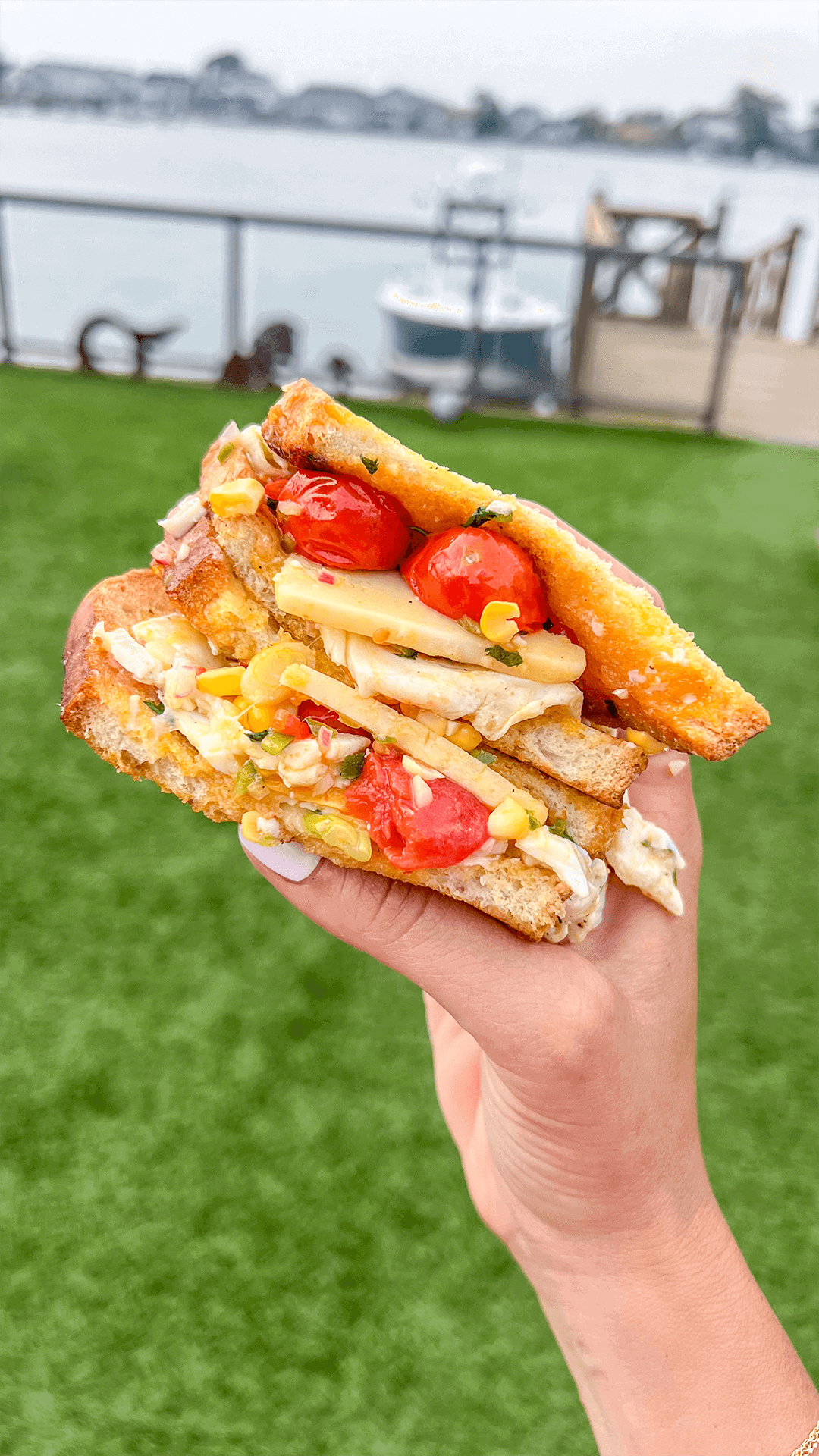 close up of blistered corn tomato sandwich