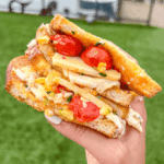 close up of blistered corn tomato sandwich