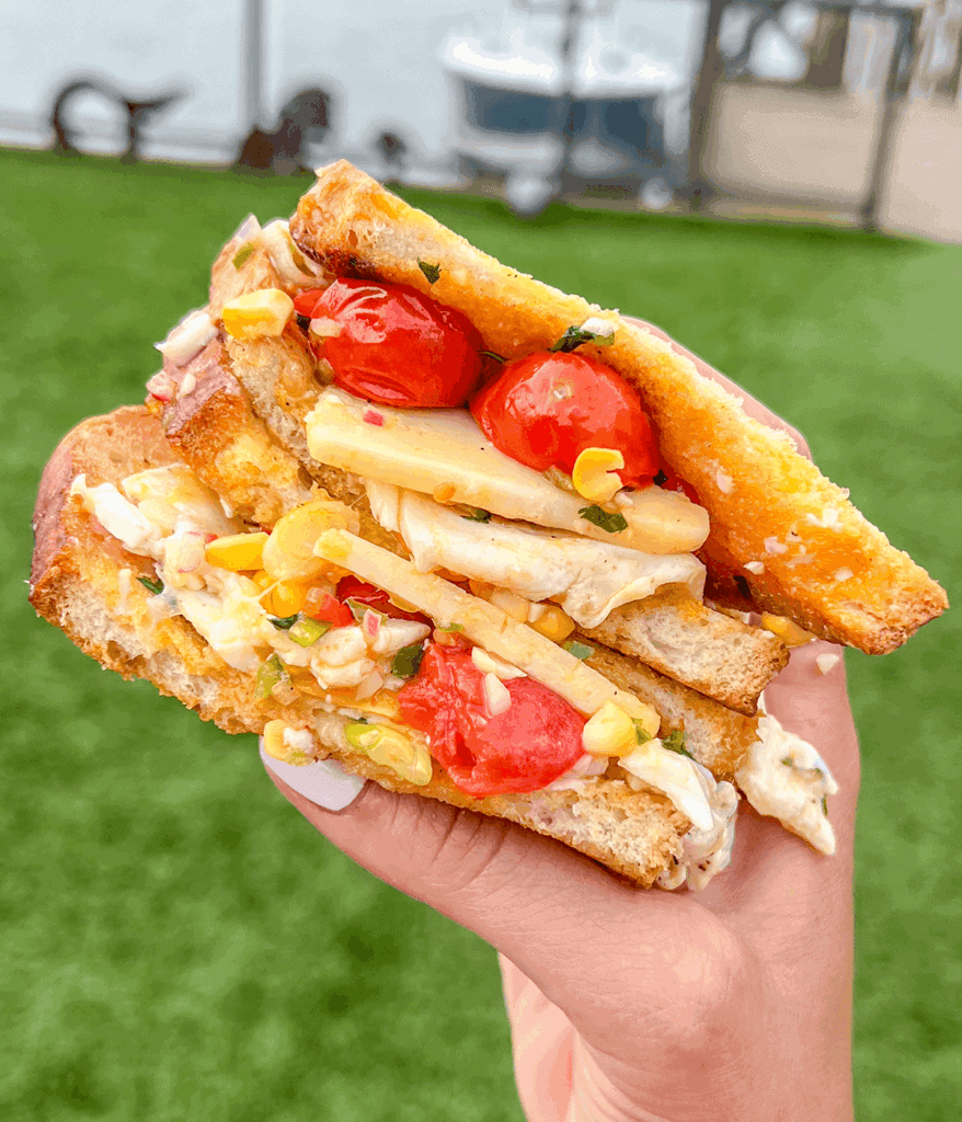 close up of blistered corn tomato sandwich