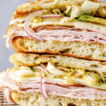 close up of ham and cheddar cheese sandwich