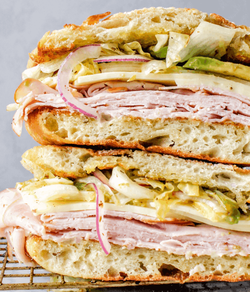 close up of ham and cheddar cheese sandwich