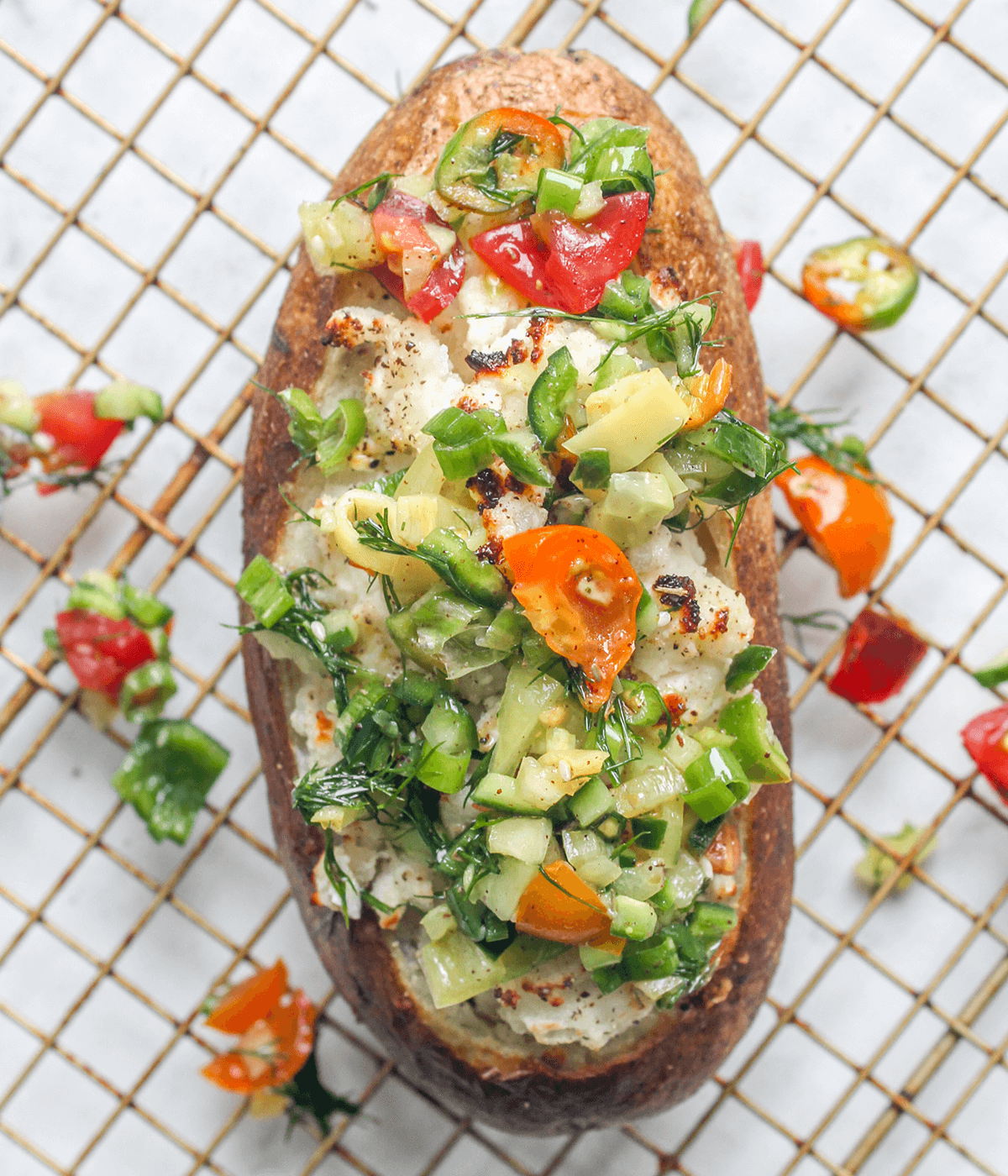 close up of a mediterranean baked potato