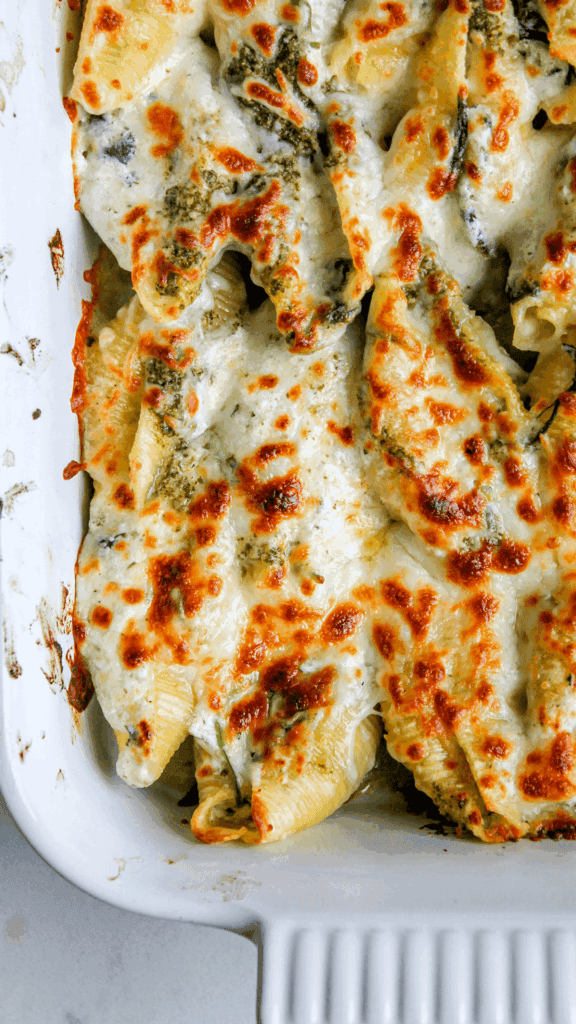 close up of pesto stuffed shells