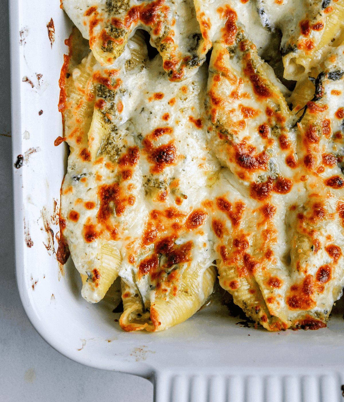 close up of pesto stuffed shells