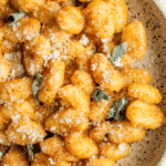 bowl of pumpkin garlic confit gnocchi
