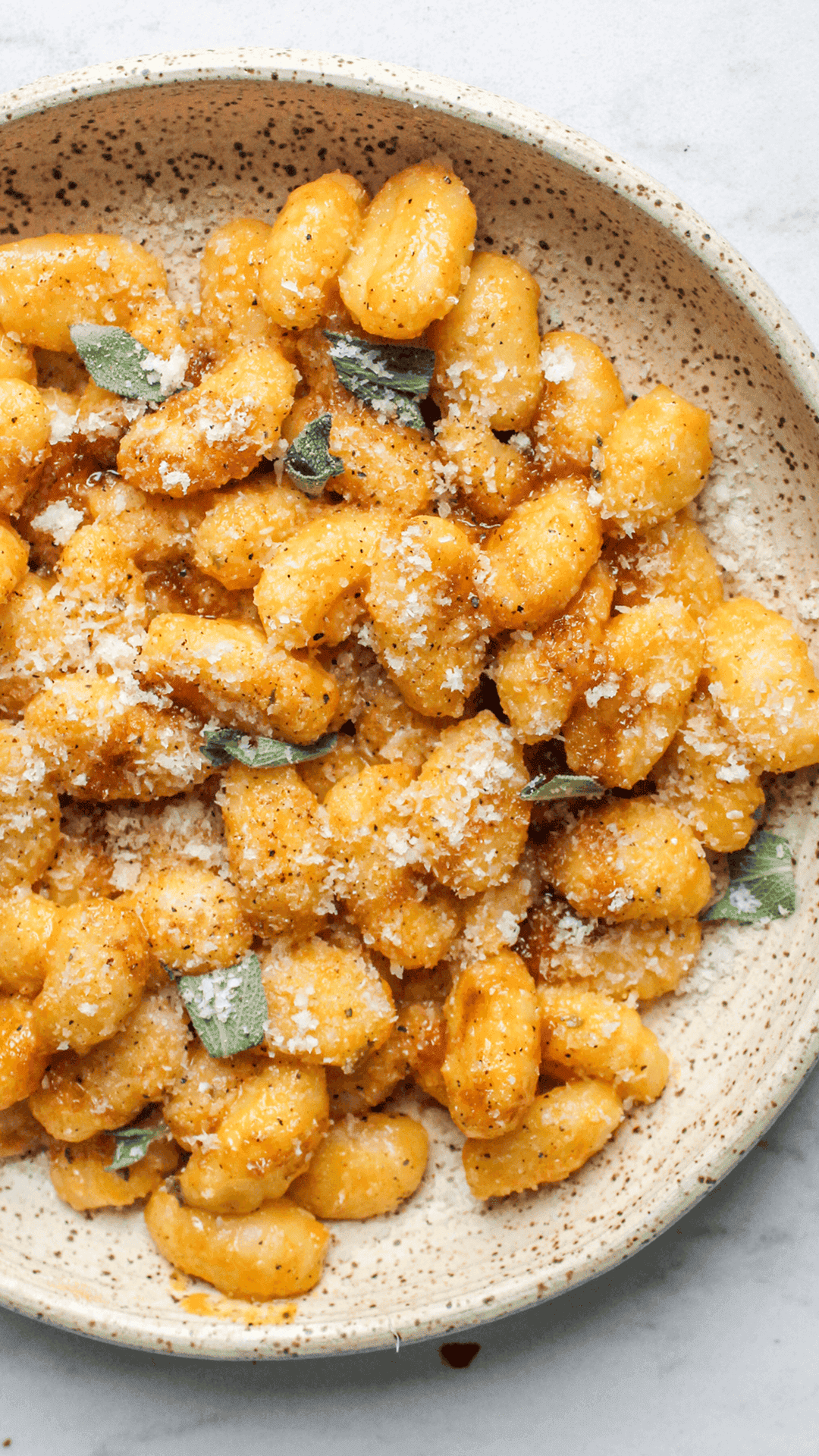 close up of pumpkin garlic confit gnocchi