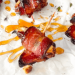 close up of a goat cheese bacon wrapped date