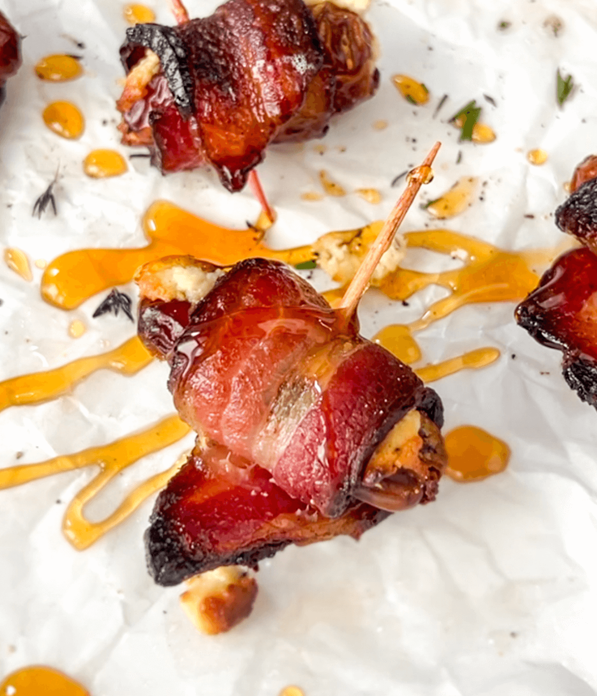 close up of a goat cheese bacon wrapped date