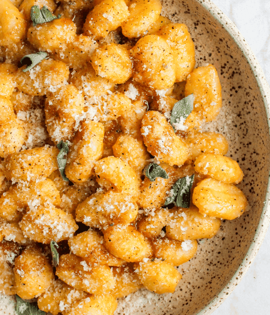 close up of pumpkin garlic confit gnocchi