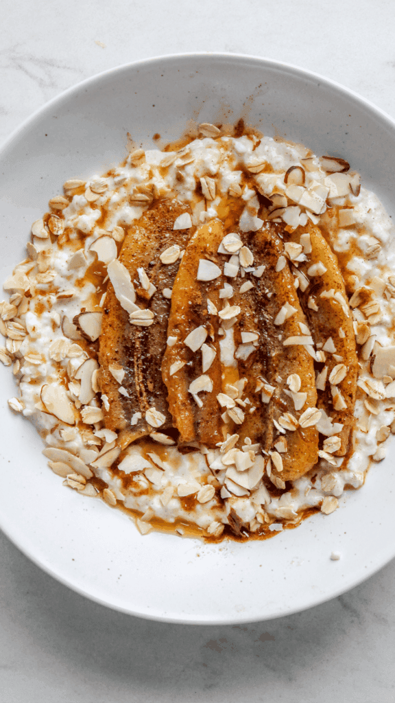close up of cottage cheese breakfast bowl with bananas