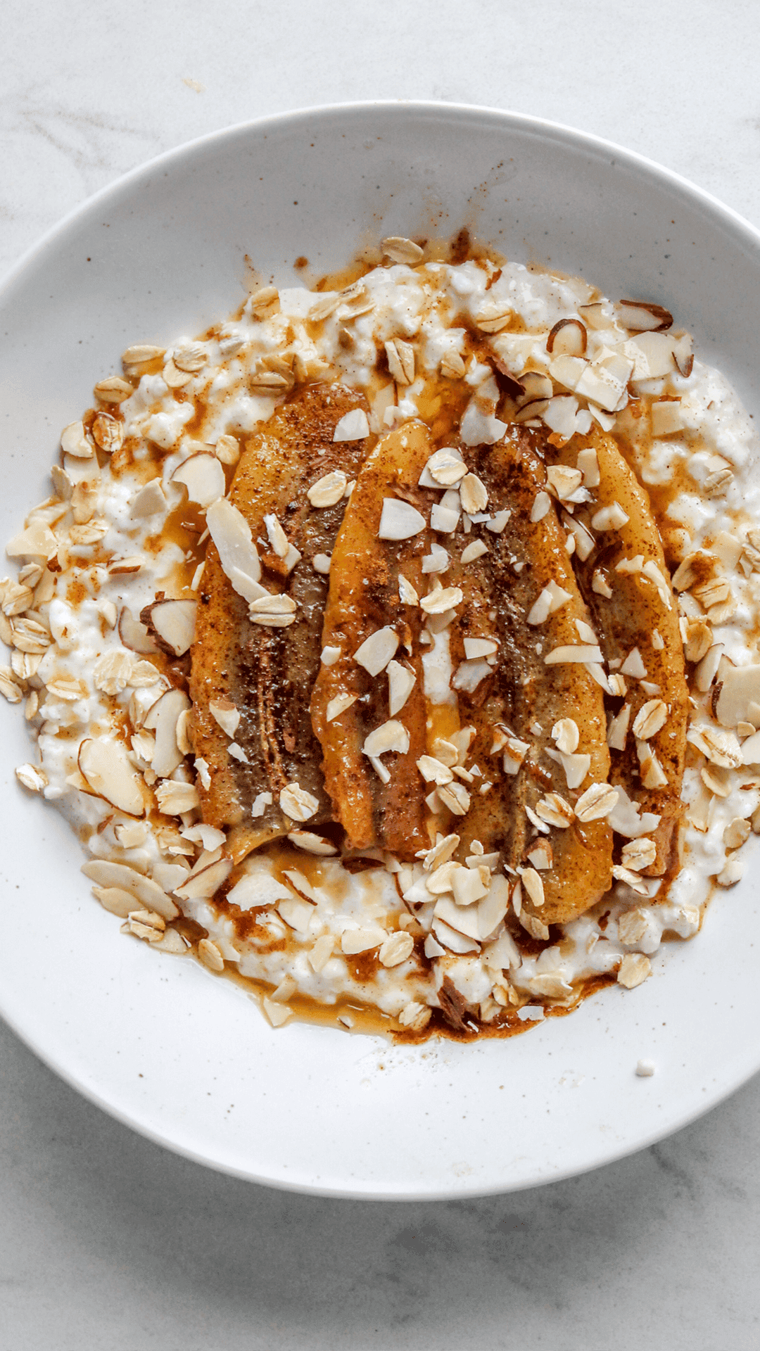 close up of cottage cheese breakfast bowl with bananas
