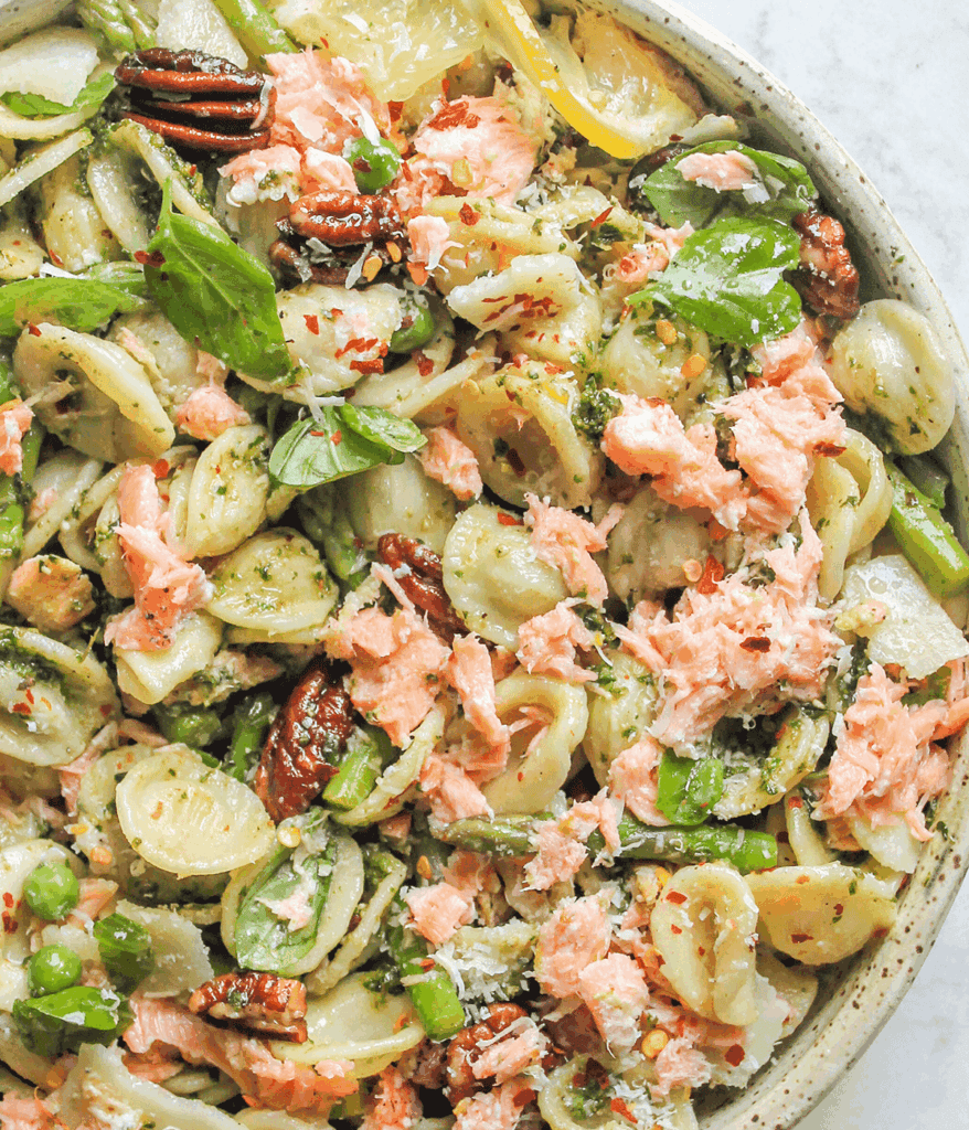 close up of salmon pesto pasta