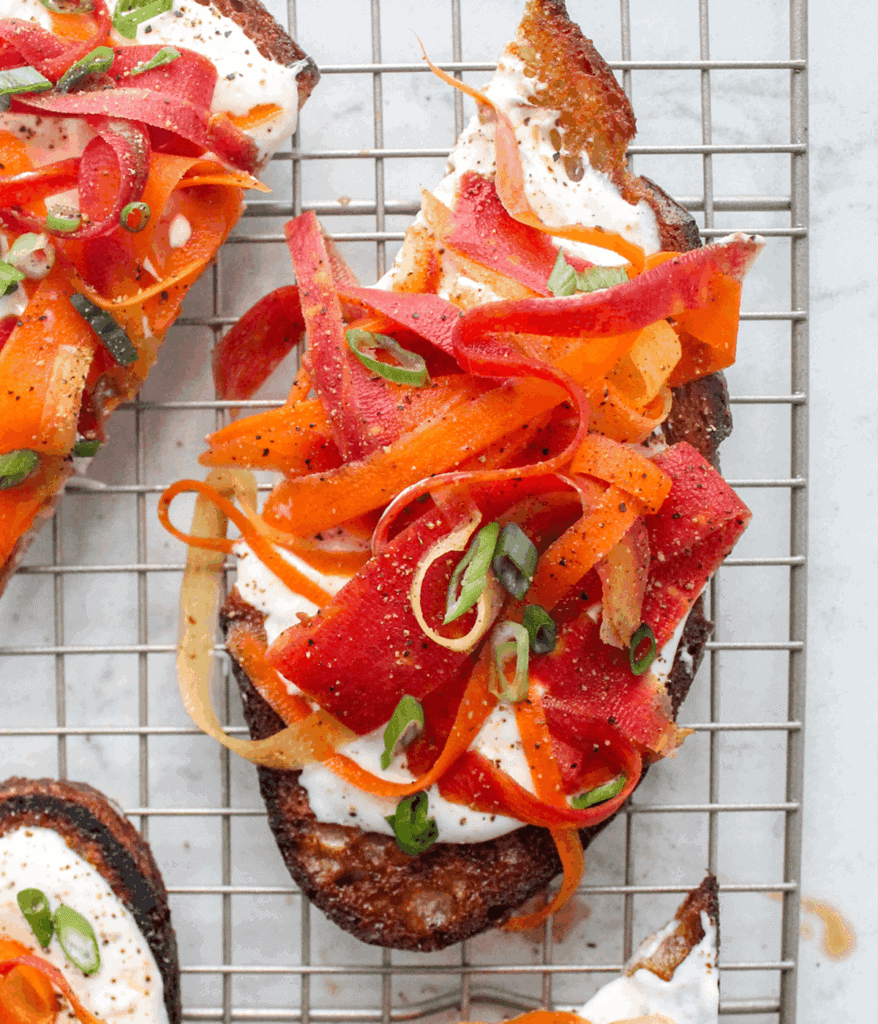 close up of miso cream cheese carrot crostinis