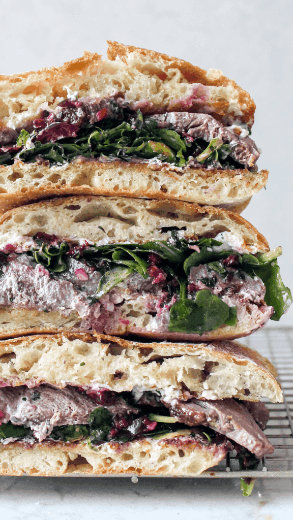 stacked duck sandwich with cherry chimichurri