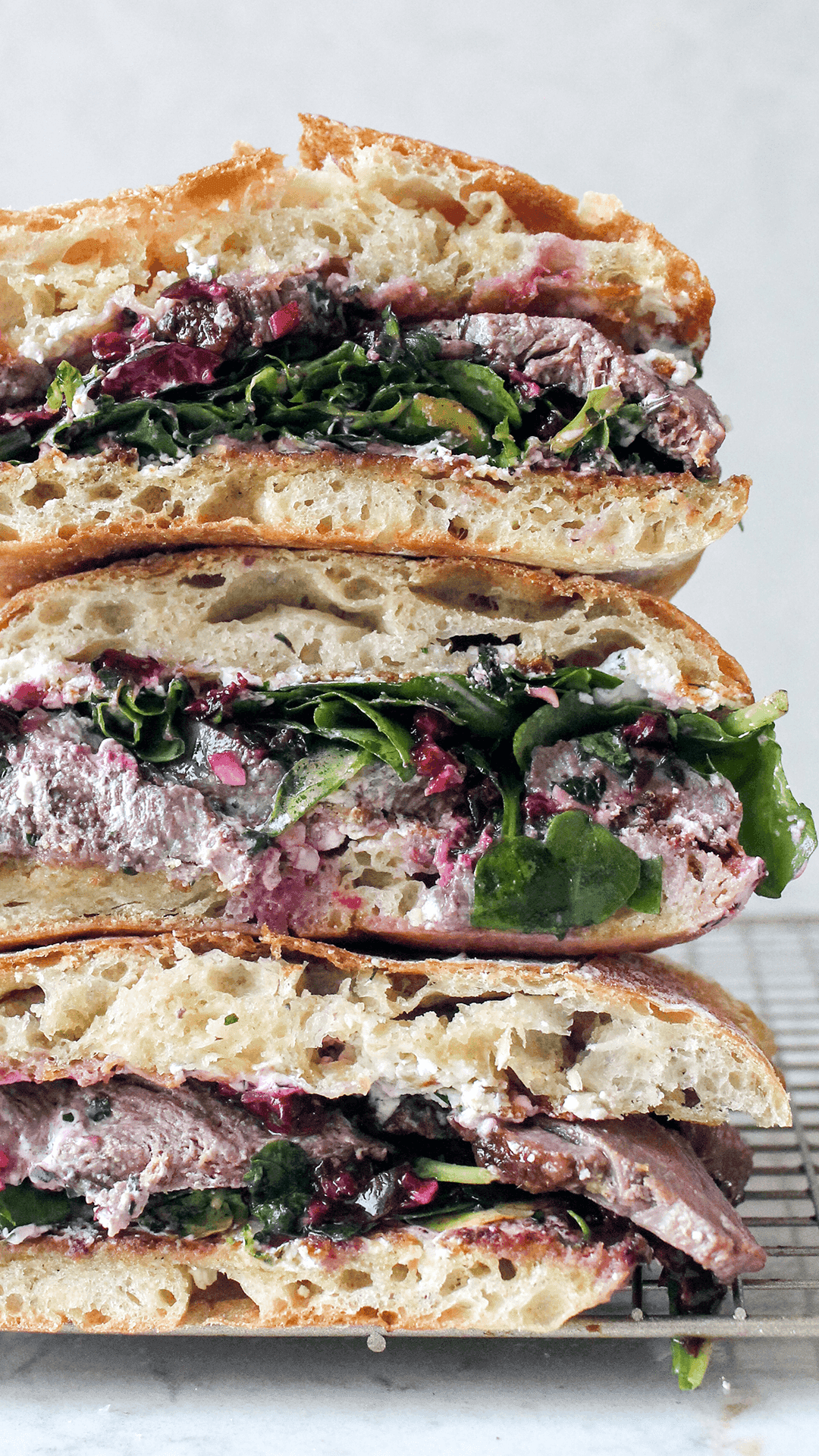 stacked duck sandwich with cherry chimichurri