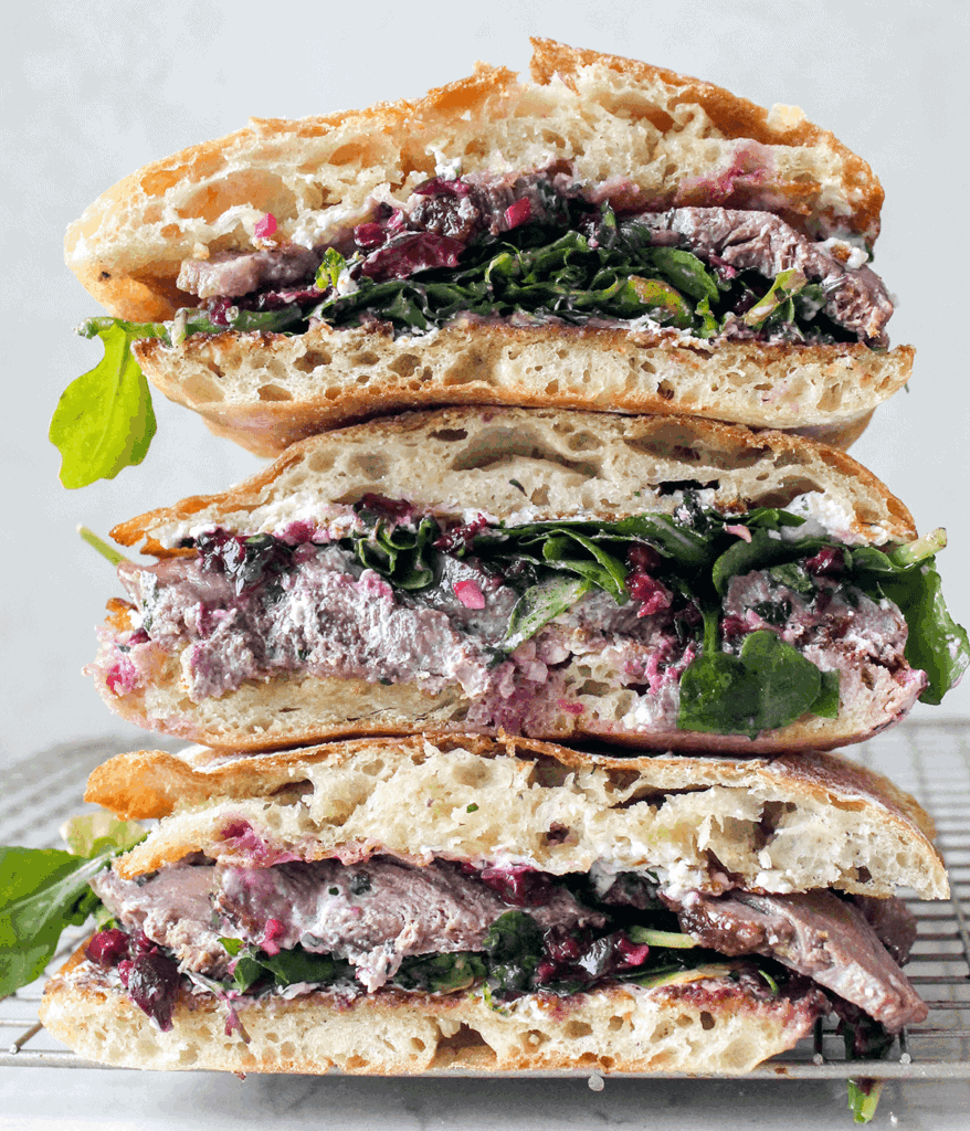 stacked duck sandwich with cherry chimichurri