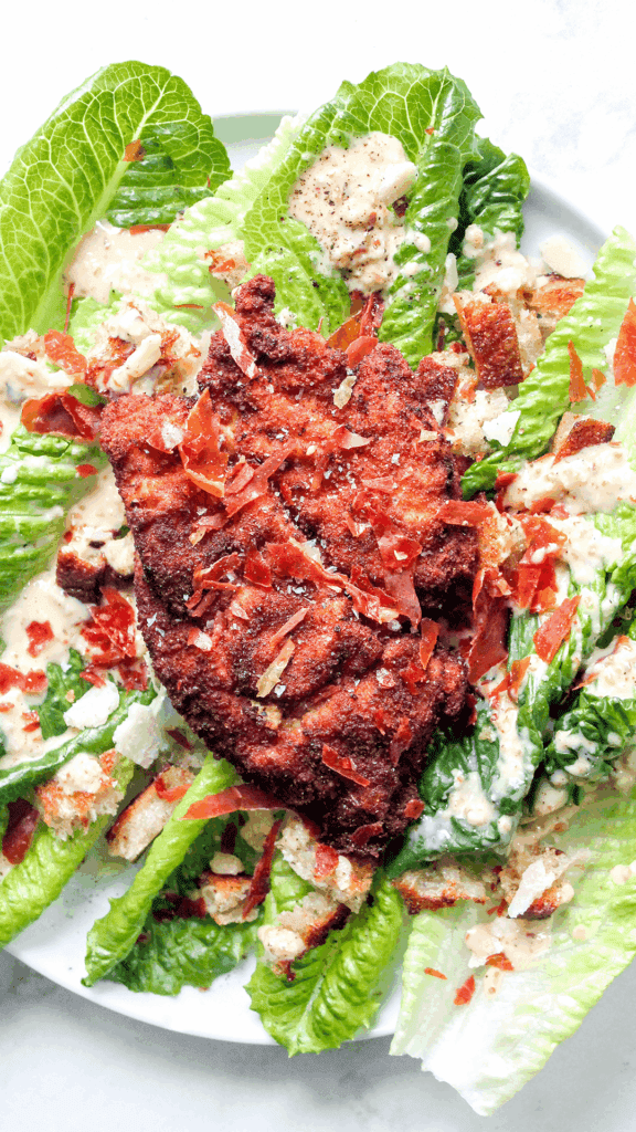spicy caesar salad with chicken cutlets from above